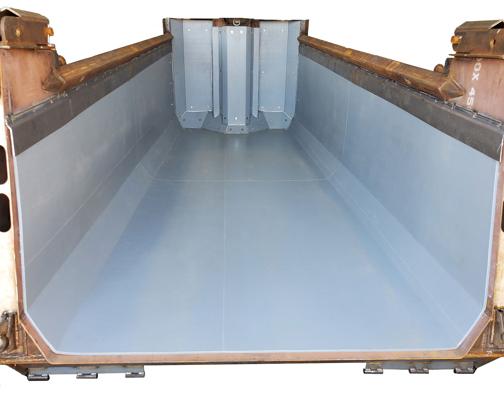 grey UHMW-PE plastic dump bed liner inside of a yellow dump truck